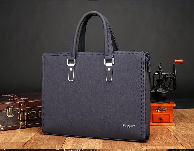 Men's dark navy briefcase with dual top handles and front buckle straps