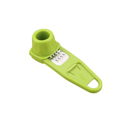 Light green manual garlic masher with grater holes and wide grip handle