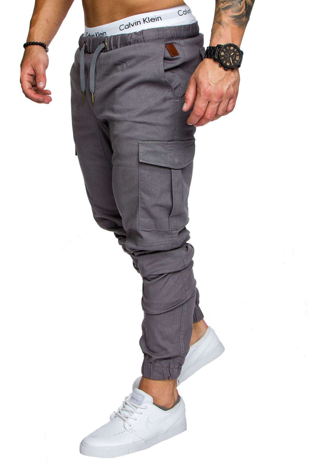 Men's gray cargo jogger pants with drawstring waist, belt loops, and side pockets