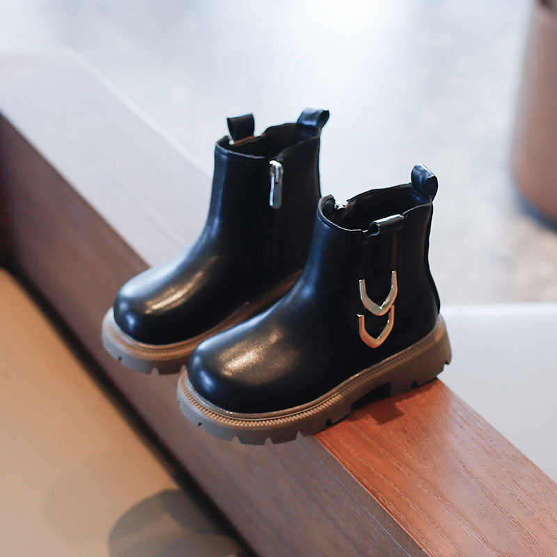 Children's black ankle boots with side zippers and light tan outsole