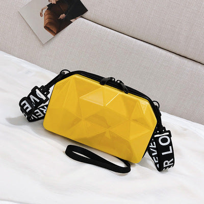 Yellow geometric mini cosmetic bag with black zipper and wrist strap