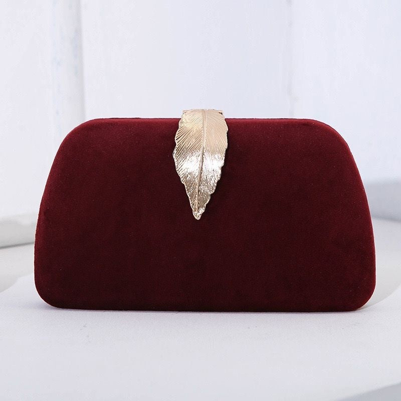 Wine red small dinner bag with gold leaf clasp and chain handle