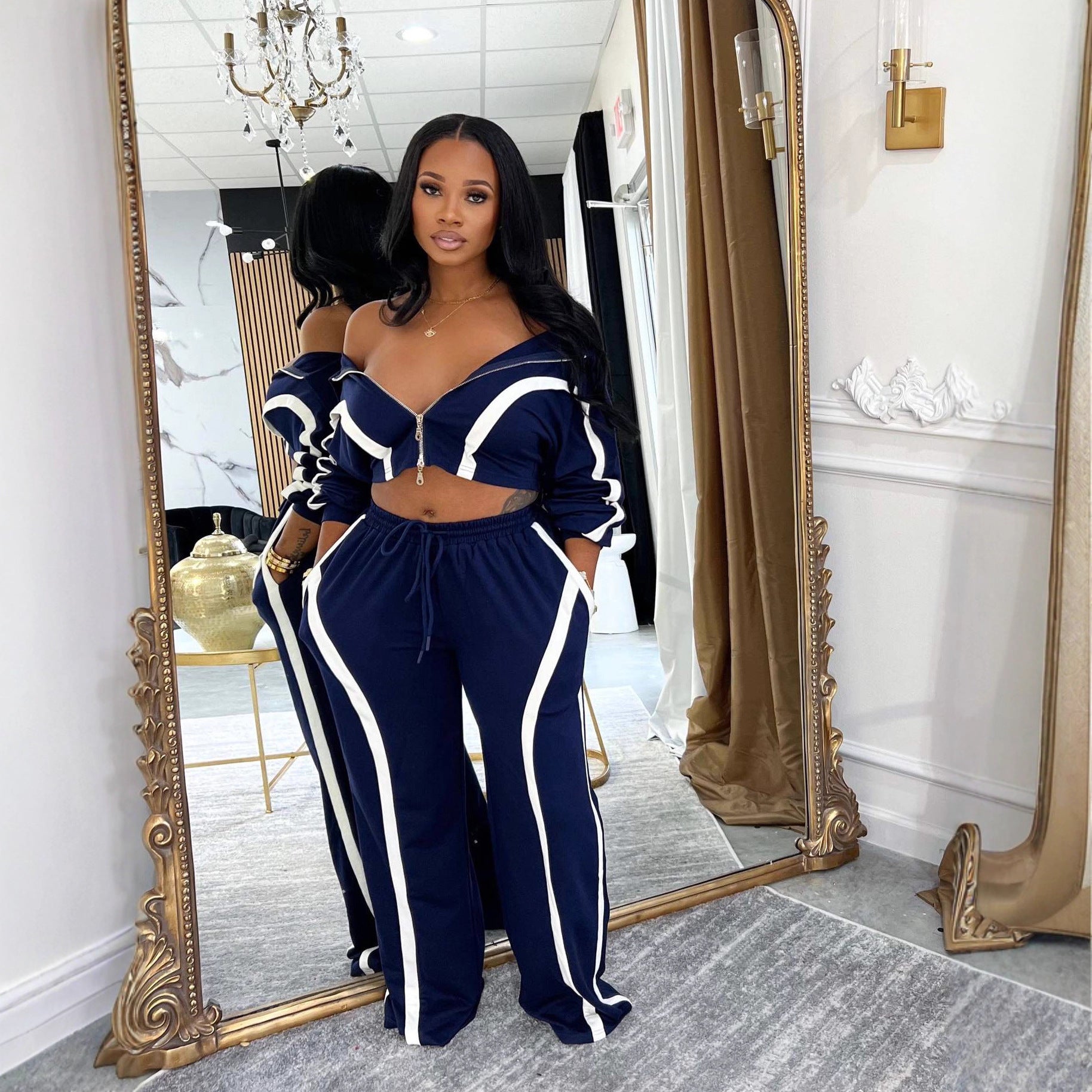 Contrast-striped two-piece cardigan set with off-shoulder cropped top and drawstring pants, navy/white