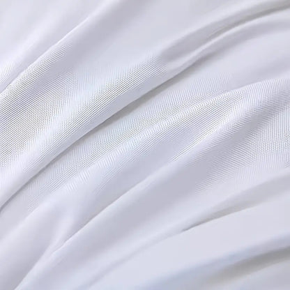White pillow fabric with fine woven texture and smooth stitched surface