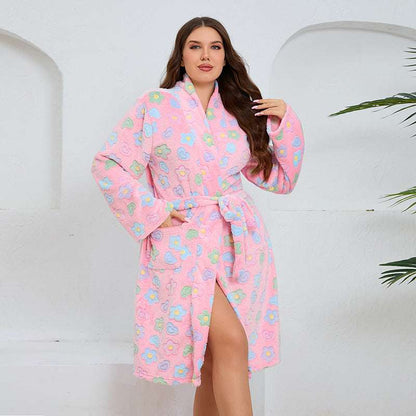 Woman wearing a pink floral robe against a white background