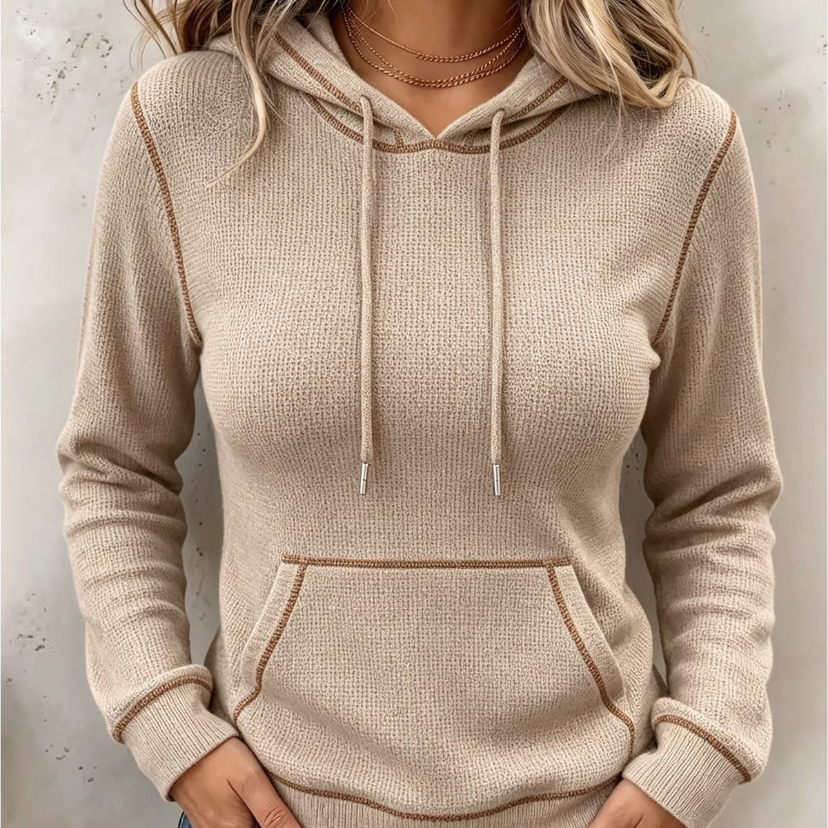 Beige long-sleeve hoodie with drawstring hood and front kangaroo pocket
