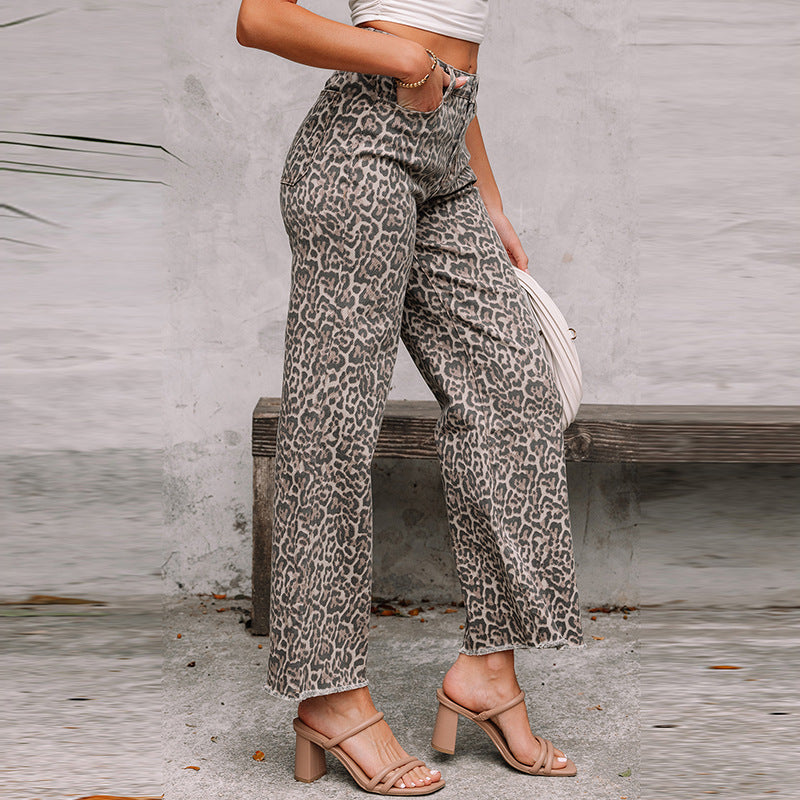 Leopard print high-waist wide-leg jeans, side view with button closure
