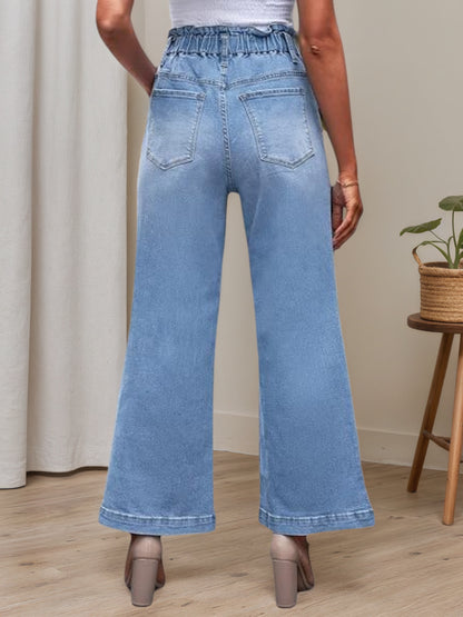 Light blue bellbottom jeans with back yoke, back pockets, and wide flared legs