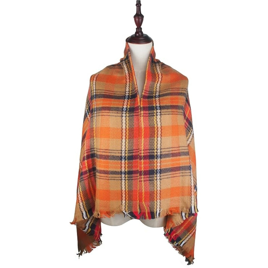 Plaid poncho-style shawl with fringe edges in orange check with navy and red lines