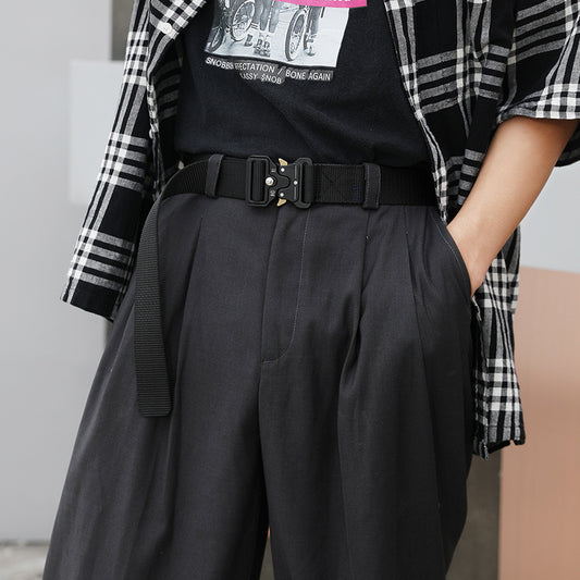 Men's Outdoor Nylon Elastic Buckle Belt Work Clothes Belt worn with stylish outfit, showcasing comfort and durability in outdoor settings.