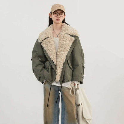 Person wearing a green coat with beige fur lining on a white background