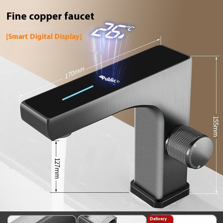 Brushed metal basin faucet with black LED display, curved spout, and textured control knob