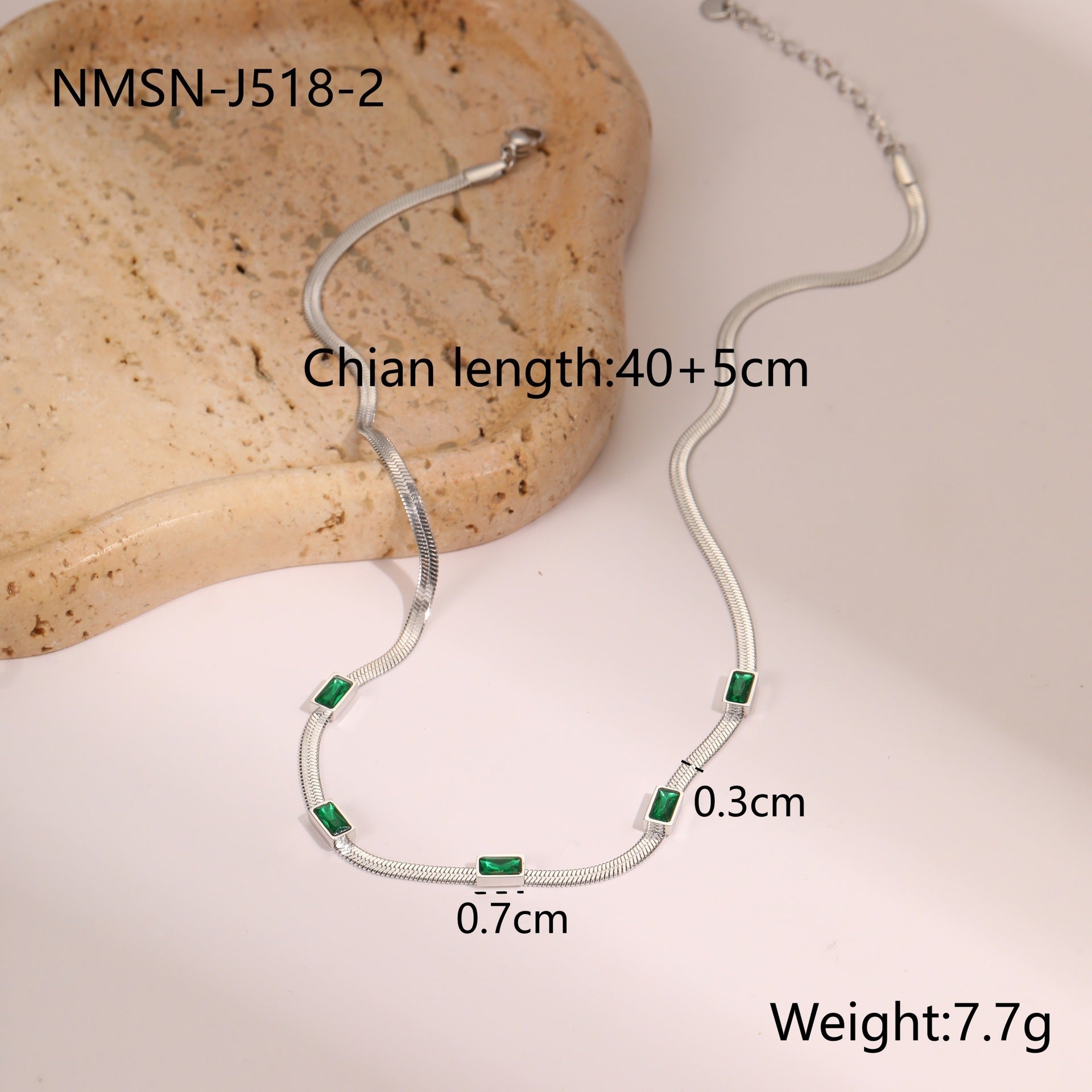 Silver snake chain necklace with square zircon links and green accents