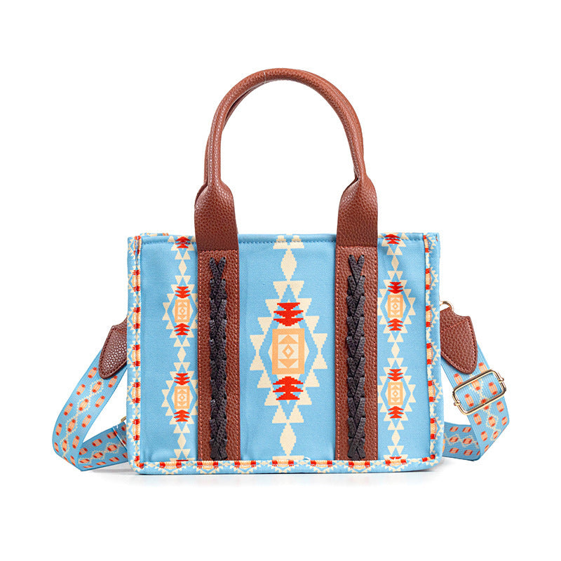 Women's woven shoulder messenger bag, sky blue with geometric print and brown leather straps.