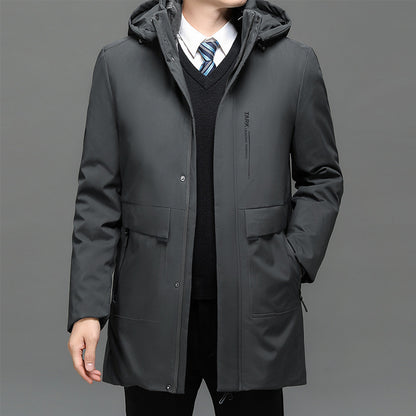 Man wearing a gray coat with a gray background
