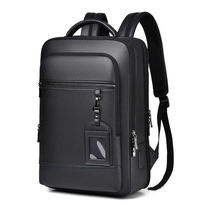 Black computer backpack with front zipper pocket and small square patch detail