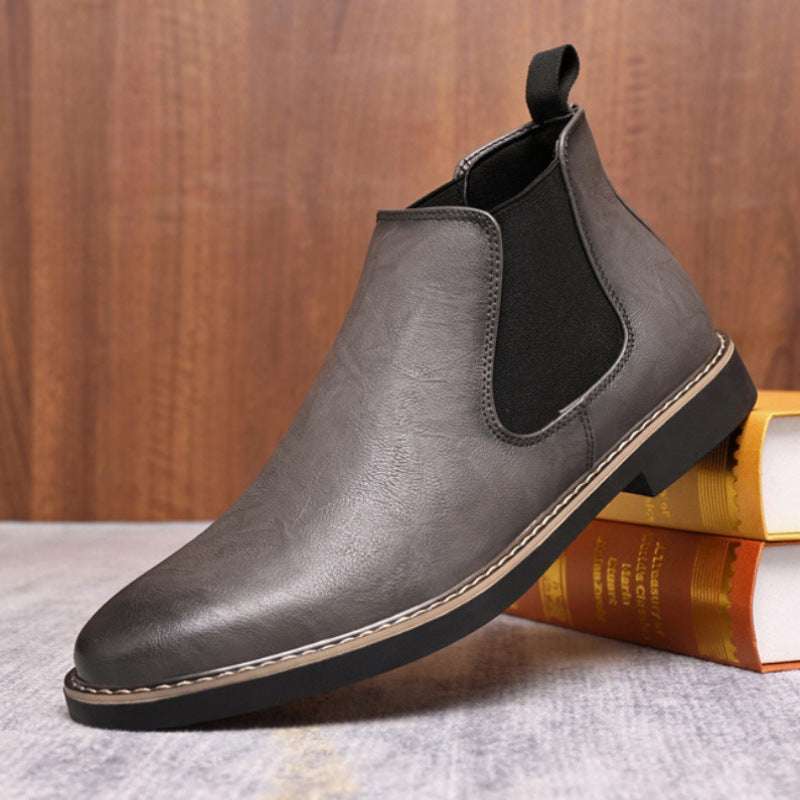 Men's gray Chelsea boot with elastic side gore and pull tab, stitched outsole trim