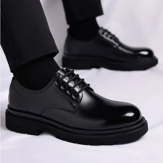 Black leather lace-up shoes with thick sole and side seam detail