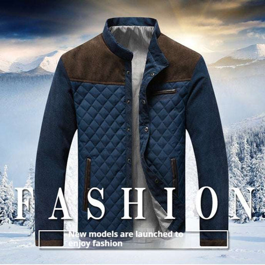 Blue quilted jacket with brown accents against a snowy mountain background