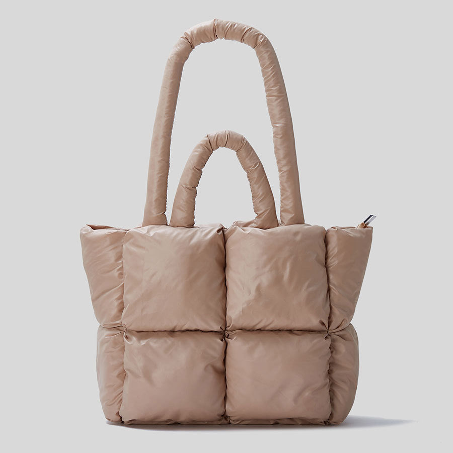 Beige puffer tote handbag with two top handles and quilted front panels