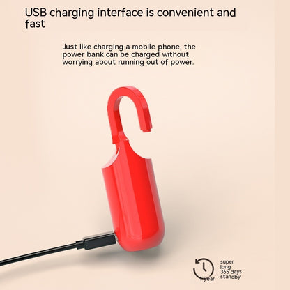 Red power bank with USB cable on a beige background