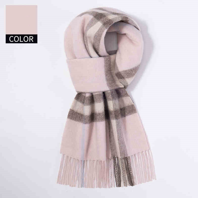 Plaid scarf with fringes on a white background
