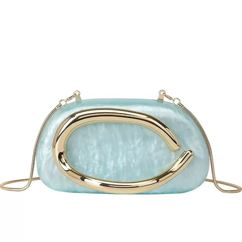 Light blue acrylic dinner clutch with oval gold clasp and short shoulder strap