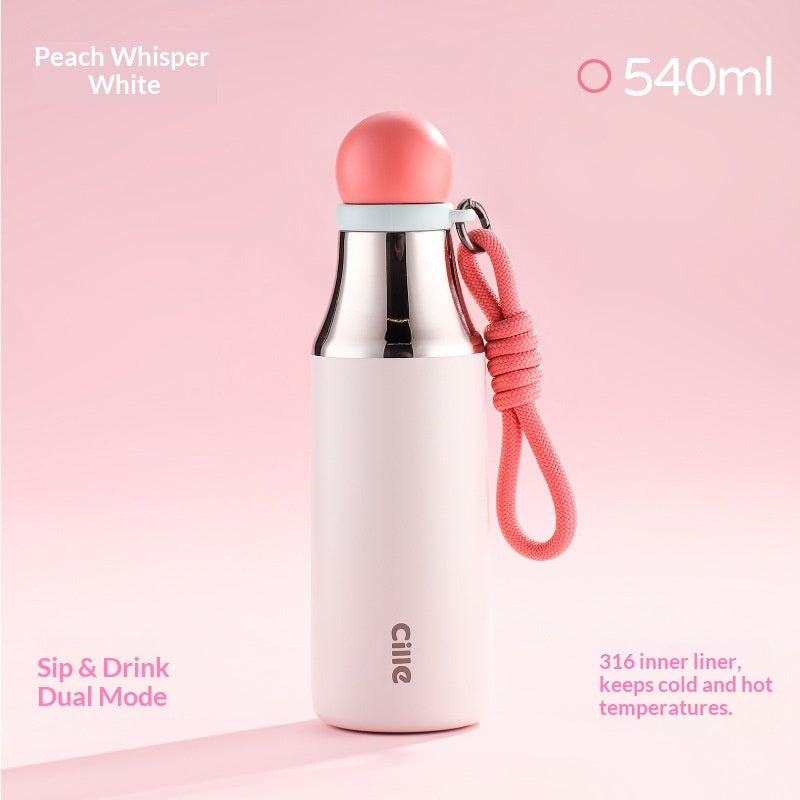 Insulated thermos mug in peach with stainless steel body, loop strap, and straw, 540 ml.