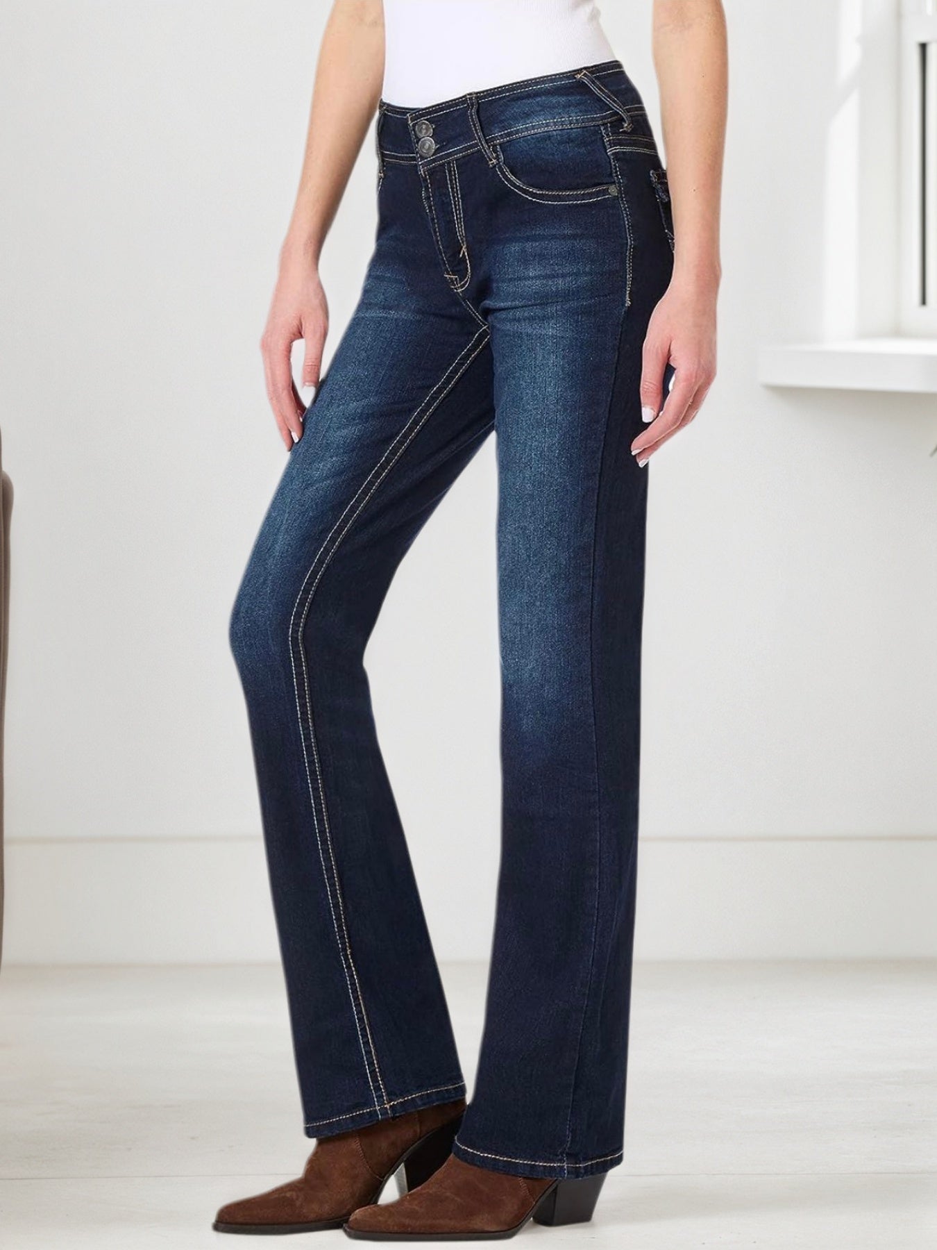 Blue embroidered pocket jeans, three-quarter back view with contrast seam detail