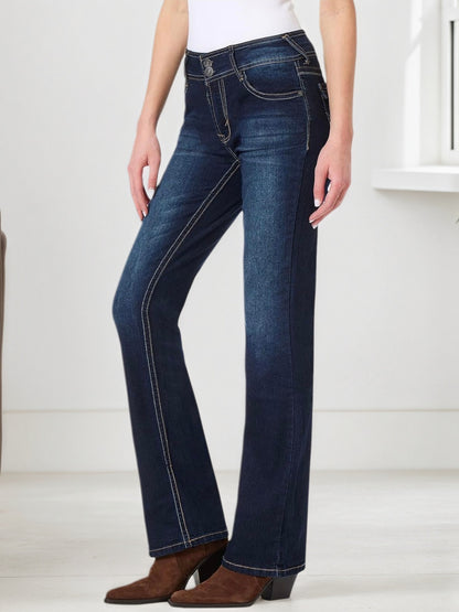 Blue embroidered pocket jeans, three-quarter back view with contrast seam detail