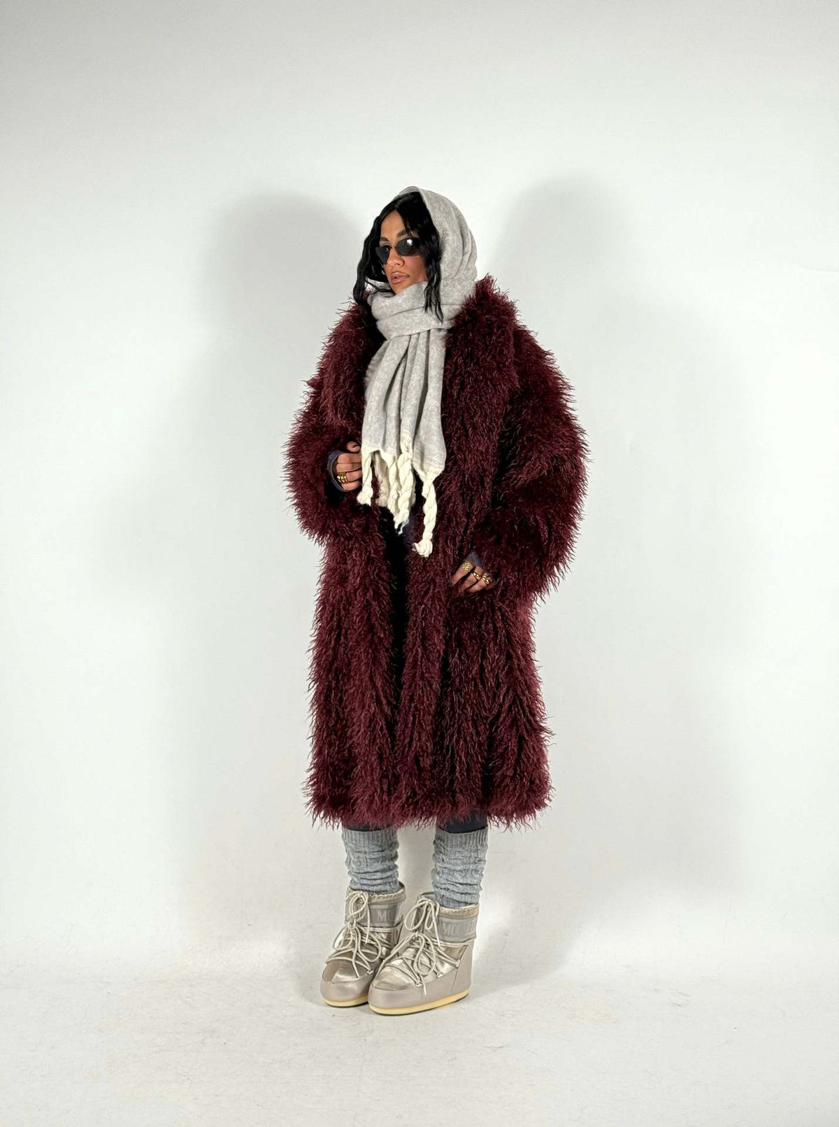 Women’s mid-length faux fur coat, deep wine red, hooded, open front, long sleeves.