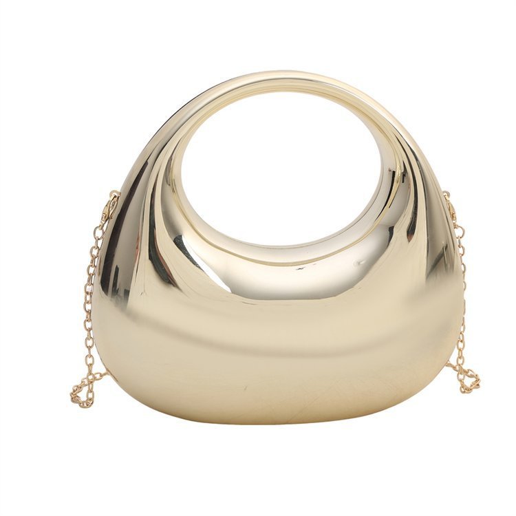 Gold half-moon acrylic crossbody bag with chain strap, reflective curved shell