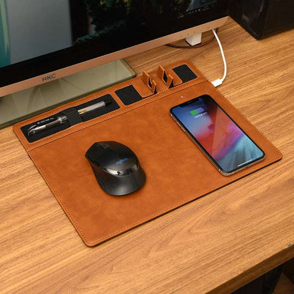 Brown leather desk mat with phone, mouse, and other items on a wooden desk.