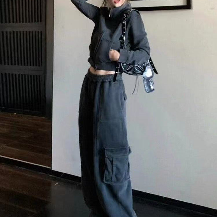 A woman modeling an oversized American retro-style tracksuit in a vintage color block design, perfect for a casual autumn streetwear look.