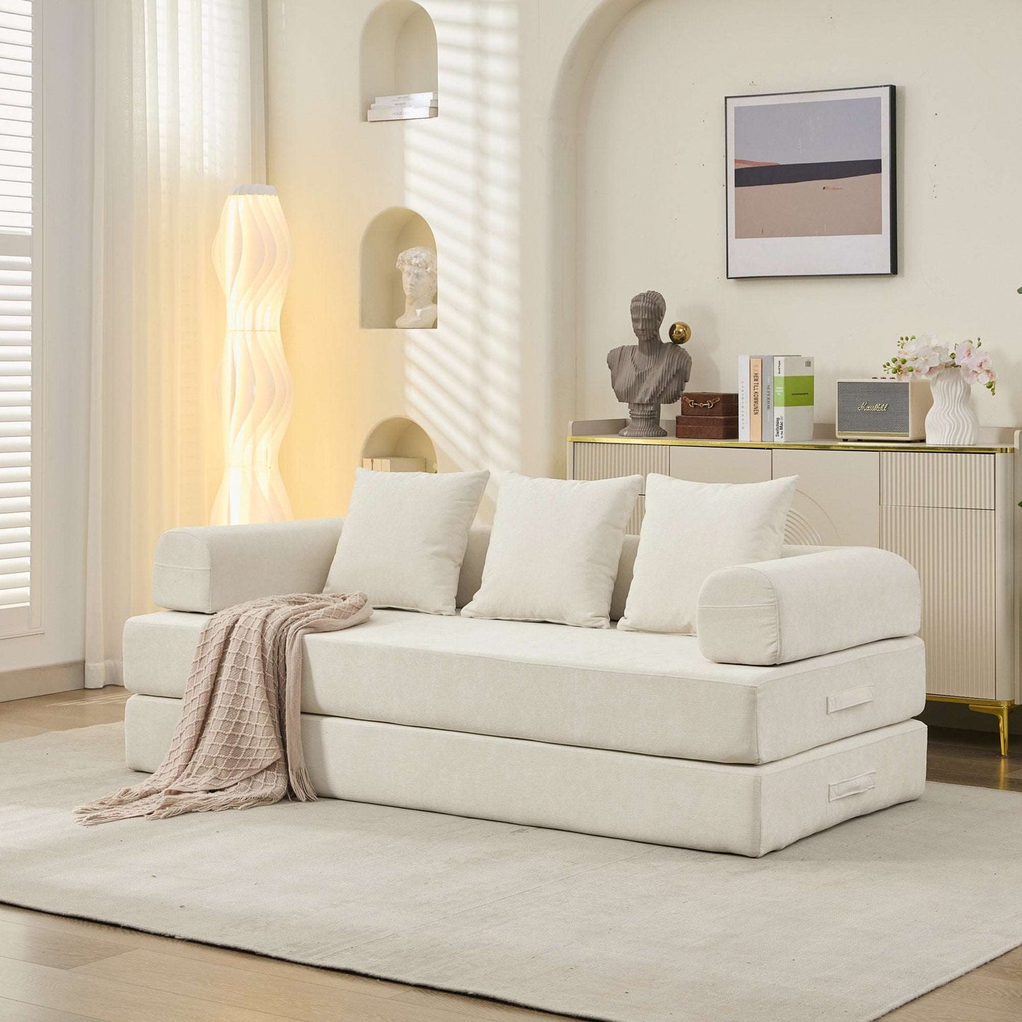 Beige convertible sofa bed with three seat cushions and three back pillows, lounge position