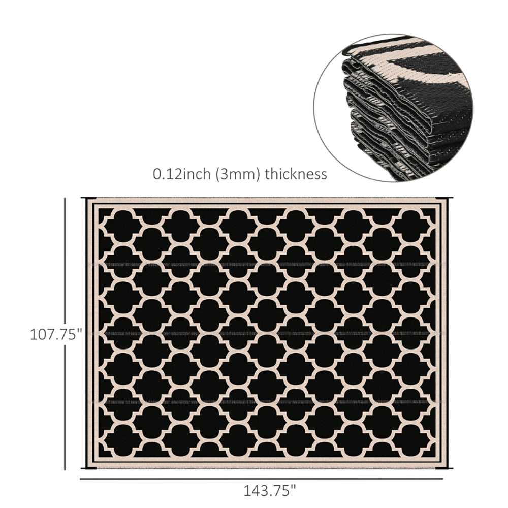 Reversible outdoor rug with black and beige geometric trellis pattern, folding waterproof mat