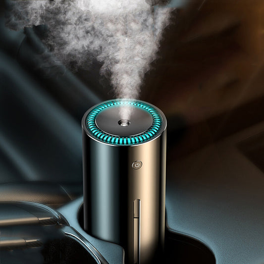 Car humidifier with steam emerging from it, placed in a car cup holder.