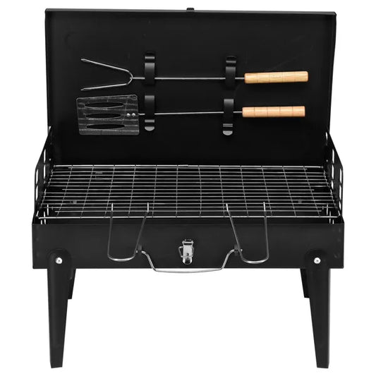 Compact black square charcoal grill measuring 44x27x7cm set up for an outdoor picnic