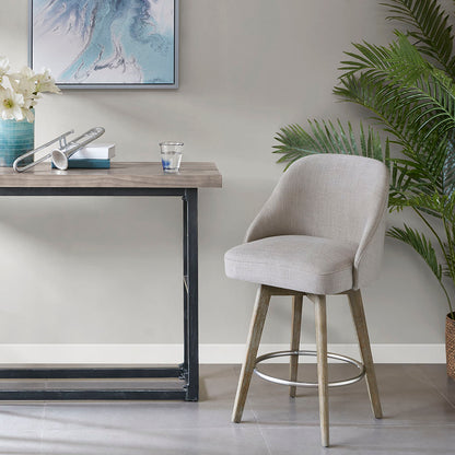 Grey upholstered swivel counter stool with rounded metal footrest and curved back