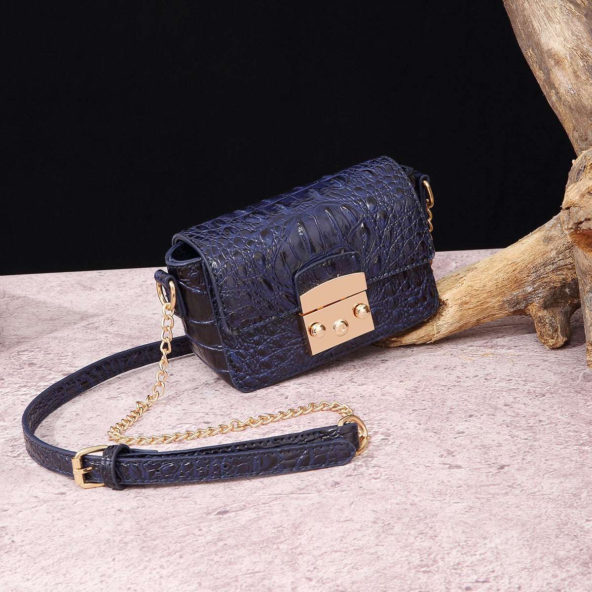 Navy blue croc-textured one-shoulder crossbody bag with flap and gold hardware