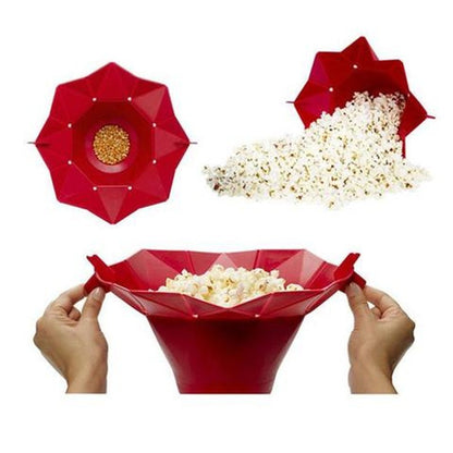 A red silicone popcorn bucket designed to be used in the microwave, shown in different states: closed with kernels, expanded with popped popcorn, and being handled by a person.
