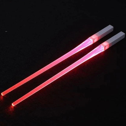 A reusable party utensil with nine colored fluorescent sticks and glowing chopsticks