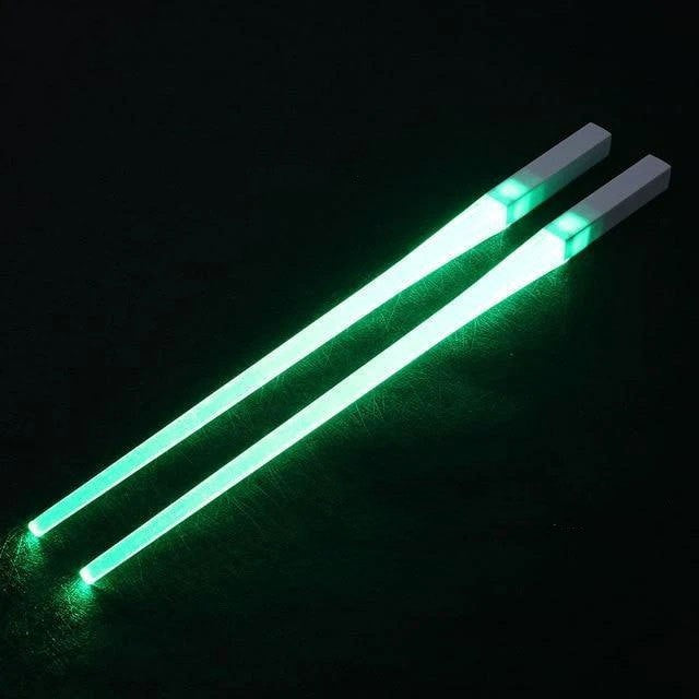 A reusable party utensil with nine colored fluorescent sticks and glowing chopsticks