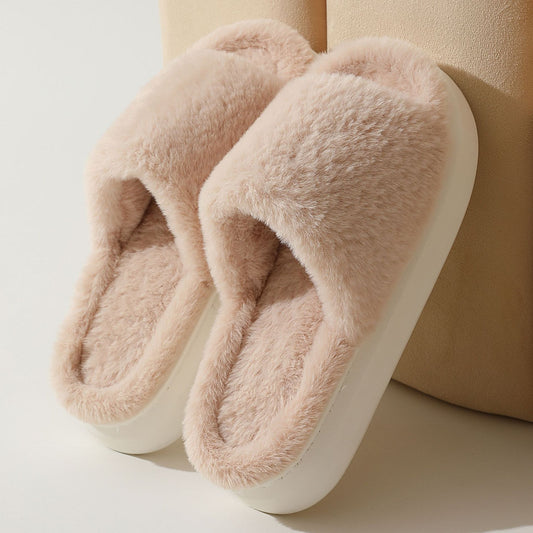 A pair of beige fluffy slippers with thick soles suitable for women's outer wear.