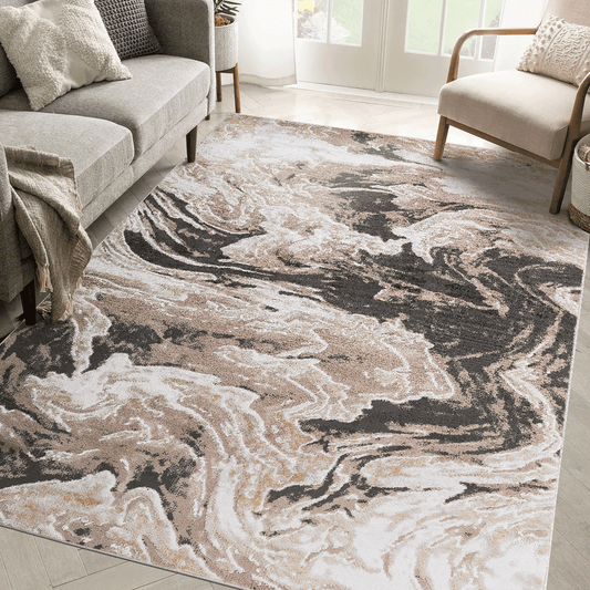 Large 6x9 abstract area rug in light brown and cream tones from the Payas Collection, styled in a modern living room setting.