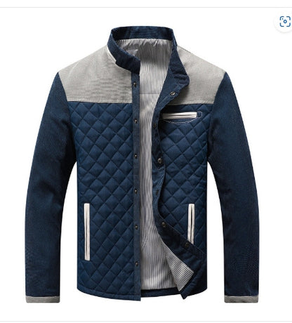 Blue quilted jacket with a white shirt underneath on a white background