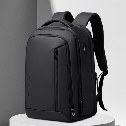 Black waterproof laptop backpack with front zip pockets and padded shoulder straps