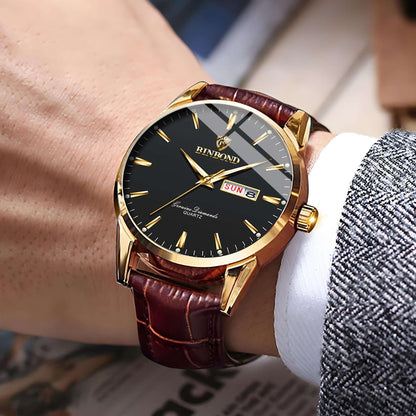 Men's quartz watch with gold case, black dial, brown leather strap and day date display