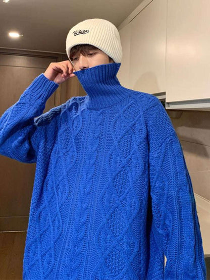 Blue knit turtleneck sweater with cable diamond pattern and long sleeves
