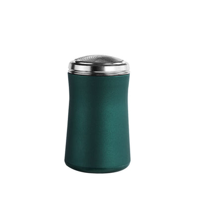 Green shaker with silver top on a white background